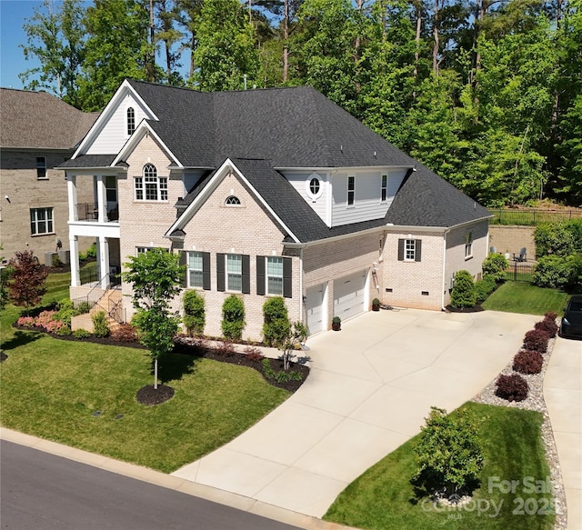 218 Turtleback Rdg, Matthews, NC 28104 - view of front facade with fence, an attached garage, a front lawn, brick siding, and concrete driveway