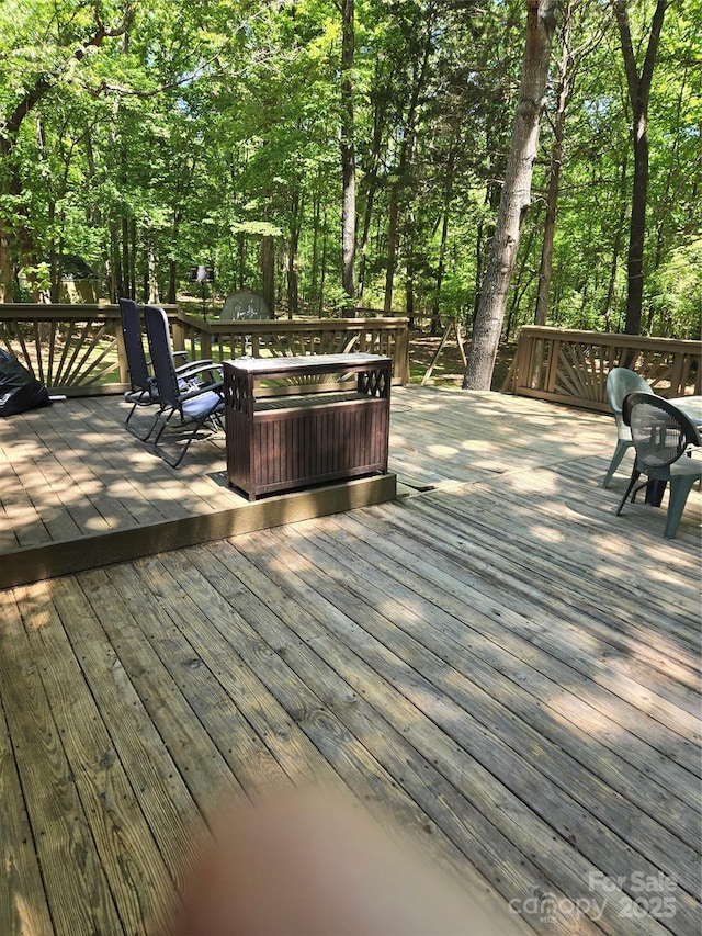 deck with outdoor dining space