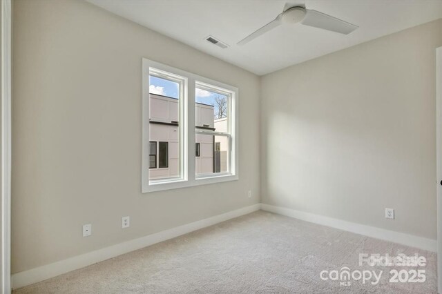 842 Van Every St, Charlotte, NC 28205 - empty room with a ceiling fan, baseboards, visible vents, and carpet
