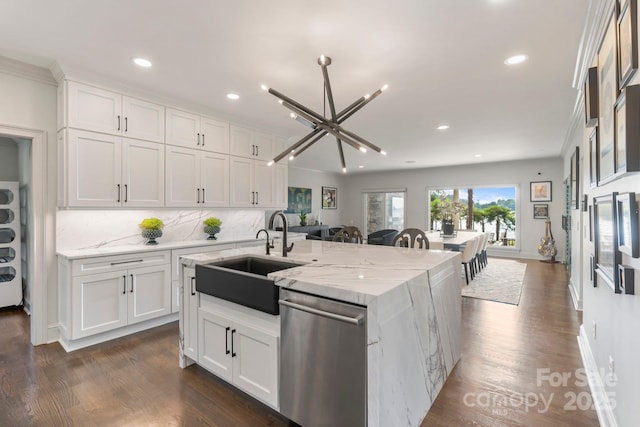 kitchen with a sink, tasteful backsplash, stainless steel dishwasher, and recessed lighting