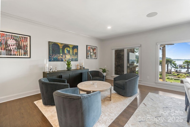 living room featuring baseboards, ornamental molding, and dark wood-style floors