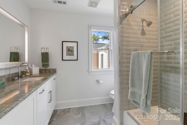 bathroom featuring vanity, visible vents, marble finish floor, toilet, and a tile shower