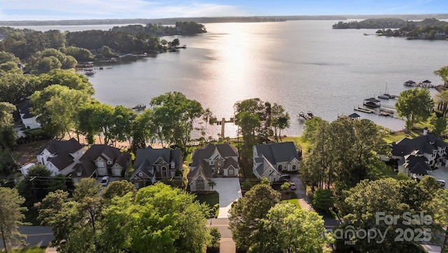 drone / aerial view featuring a water view and a residential view