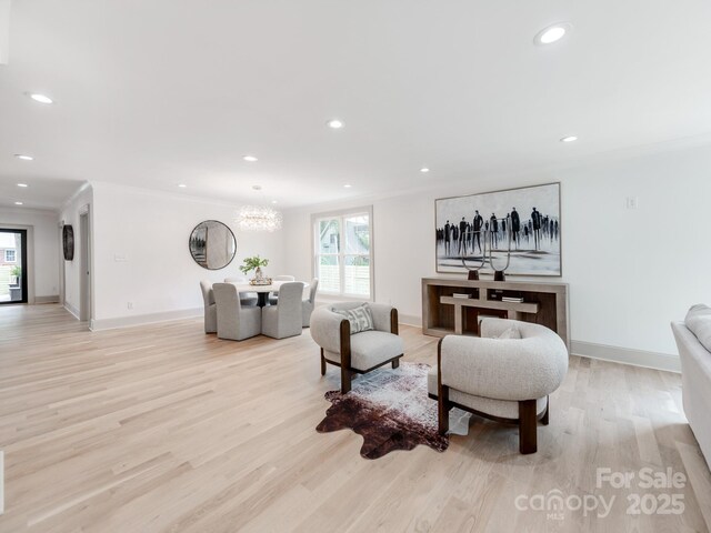 3501 Providence Rd, Charlotte, NC 28211 - living room with healthy amount of natural light, light wood finished floors, a chandelier, baseboards, and recessed lighting