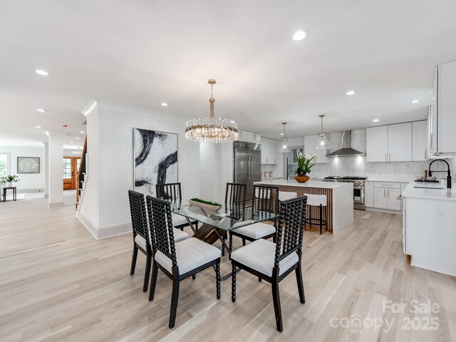 3501 Providence Rd, Charlotte, NC 28211 - dining space featuring light wood finished floors, recessed lighting, baseboards, and a chandelier