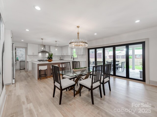 3501 Providence Rd, Charlotte, NC 28211 - dining area featuring light wood-type flooring, recessed lighting, crown molding, and a chandelier