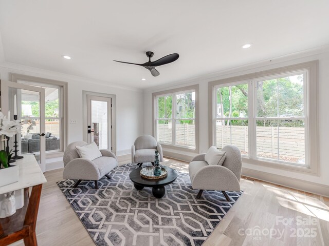 3501 Providence Rd, Charlotte, NC 28211 - living room with crown molding, light wood-style flooring, healthy amount of natural light, a ceiling fan, and baseboards