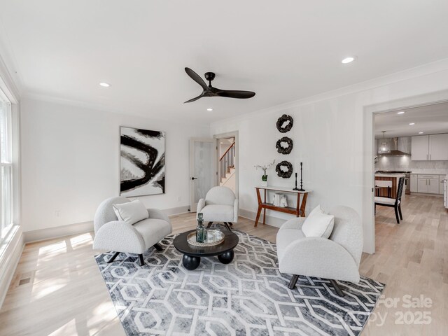 3501 Providence Rd, Charlotte, NC 28211 - living room featuring crown molding, light wood-type flooring, stairway, recessed lighting, and a ceiling fan