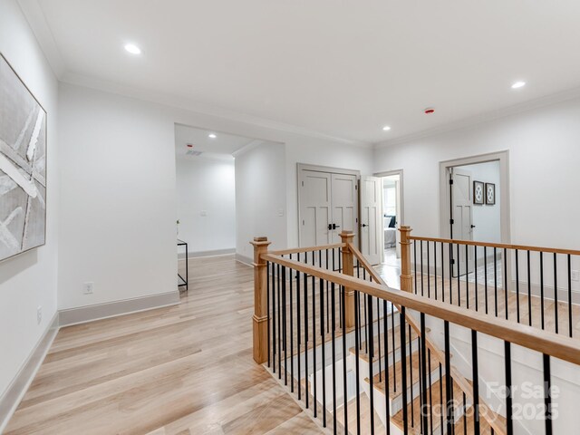 3501 Providence Rd, Charlotte, NC 28211 - corridor with an upstairs landing, light wood-type flooring, crown molding, recessed lighting, and baseboards