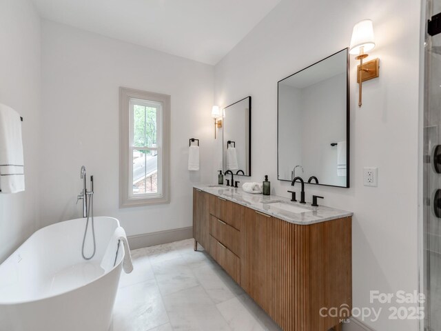 3501 Providence Rd, Charlotte, NC 28211 - full bath with double vanity, a freestanding tub, and baseboards