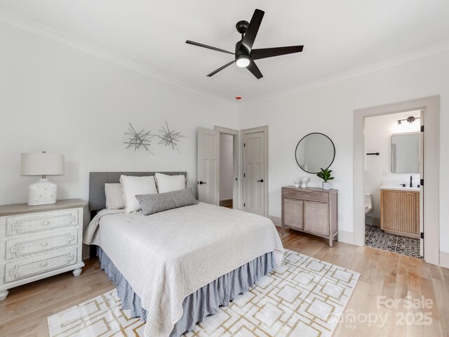 3501 Providence Rd, Charlotte, NC 28211 - bedroom with crown molding, wood finished floors, ensuite bath, ceiling fan, and a sink