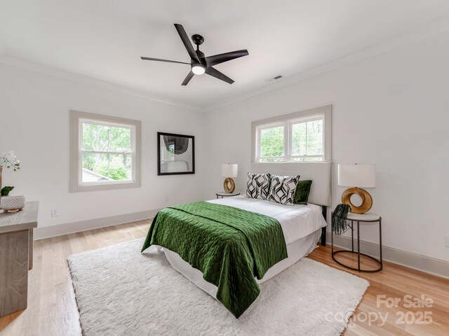 3501 Providence Rd, Charlotte, NC 28211 - bedroom featuring crown molding, light wood finished floors, baseboards, and ceiling fan