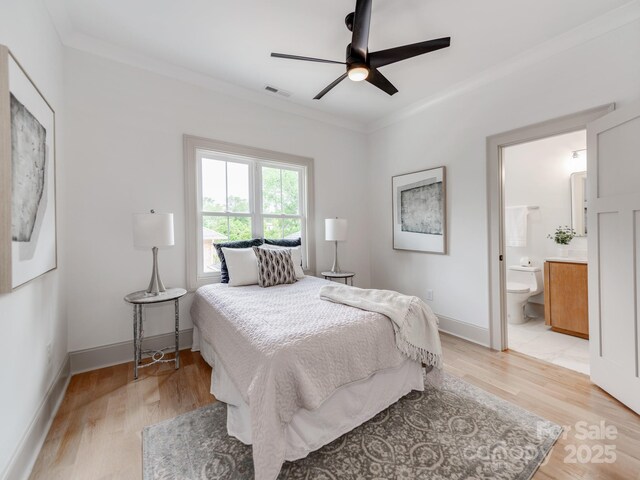 3501 Providence Rd, Charlotte, NC 28211 - bedroom featuring crown molding, light wood-style flooring, baseboards, ensuite bath, and a ceiling fan