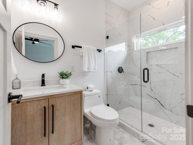 3501 Providence Rd, Charlotte, NC 28211 - full bathroom featuring a marble finish shower, toilet, ceiling fan, and vanity