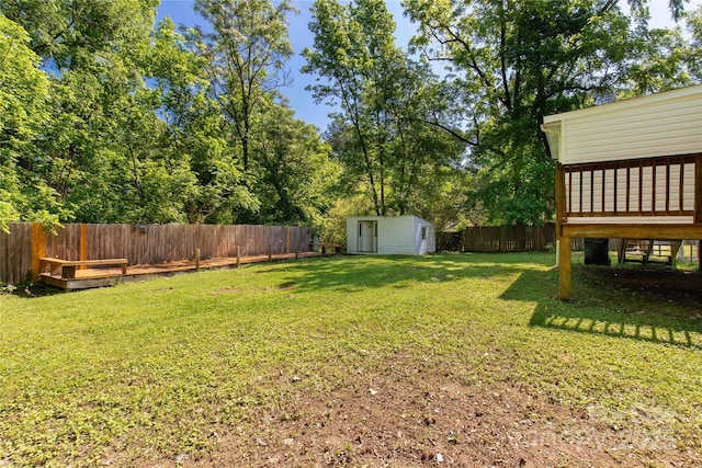 view of yard with a storage shed and an outdoor structure
