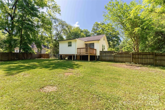 back of house with a deck