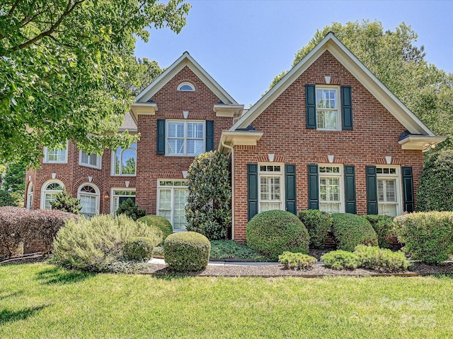 16511 Bridgehampton Club Dr, Charlotte, NC 28277 - colonial home with brick siding and a front lawn