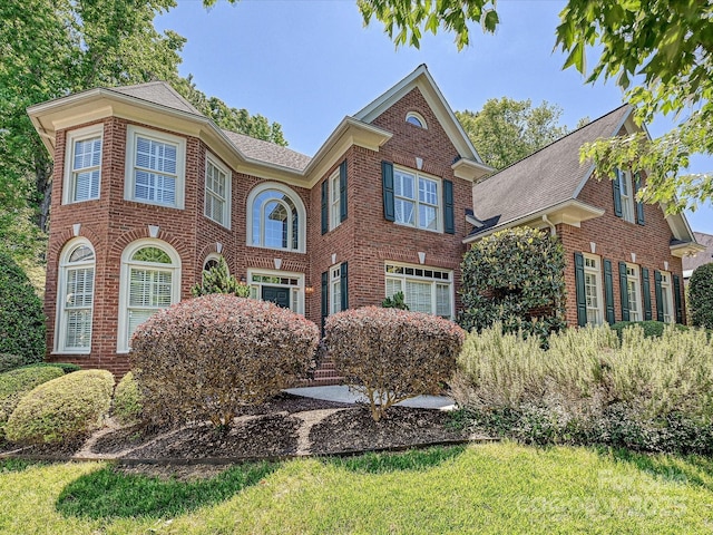 16511 Bridgehampton Club Dr, Charlotte, NC 28277 - view of front facade with brick siding and roof with shingles