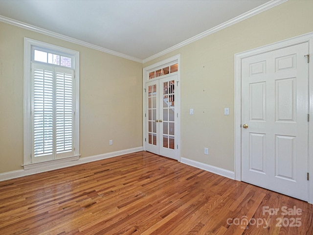 16511 Bridgehampton Club Dr, Charlotte, NC 28277 - empty room featuring french doors, ornamental molding, wood finished floors, and baseboards