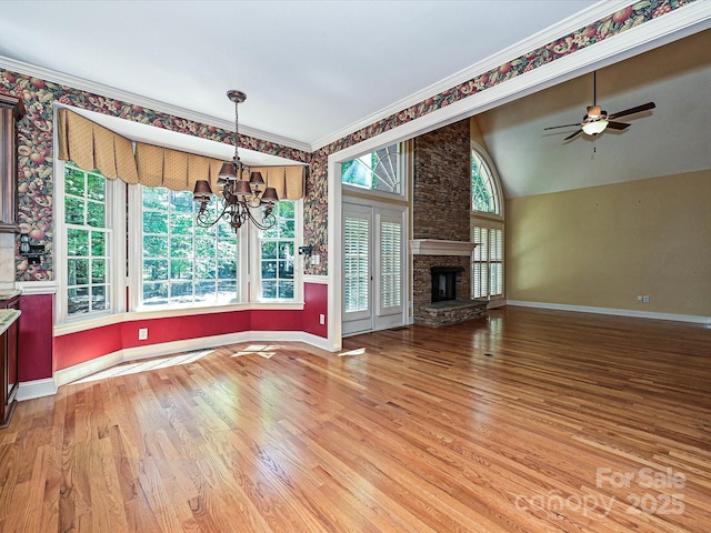 16511 Bridgehampton Club Dr, Charlotte, NC 28277 - unfurnished living room featuring light wood-style floors, a chandelier, baseboards, ceiling fan, and a stone fireplace