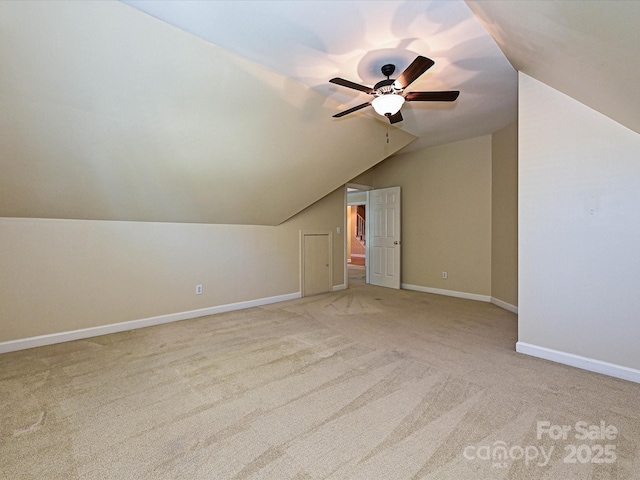 16511 Bridgehampton Club Dr, Charlotte, NC 28277 - bonus room featuring lofted ceiling, light colored carpet, ceiling fan, and baseboards