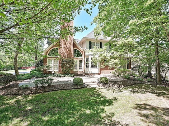 16511 Bridgehampton Club Dr, Charlotte, NC 28277 - back of house with french doors, a patio, brick siding, a yard, and a chimney