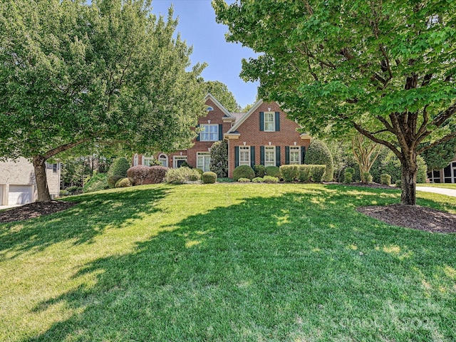 16511 Bridgehampton Club Dr, Charlotte, NC 28277 - view of front facade with a front lawn and brick siding