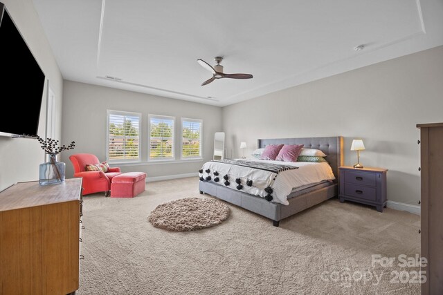bedroom with carpet floors, a ceiling fan, and baseboards
