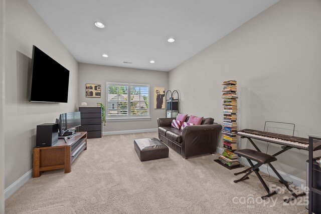 living room featuring carpet floors, recessed lighting, and baseboards