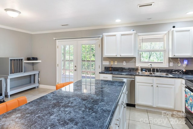 kitchen with a sink, dishwasher, french doors, light tile patterned floors, and visible vents