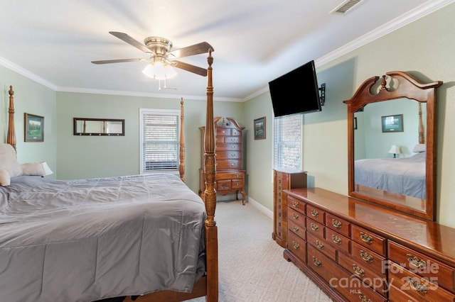 bedroom with light carpet, a ceiling fan, baseboards, visible vents, and ornamental molding