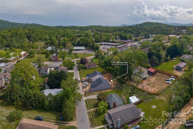 bird's eye view with a forest view and a residential view