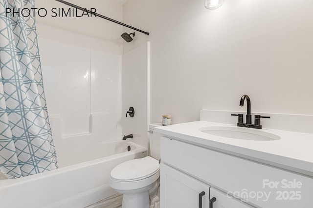full bathroom featuring toilet, vanity, and shower / tub combo