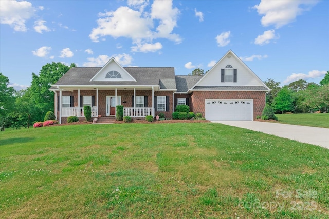 view of front of house featuring a porch, driveway, brick siding, and a front yard