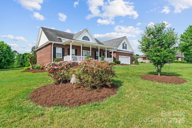 view of front of home with a porch, brick siding, and a front yard