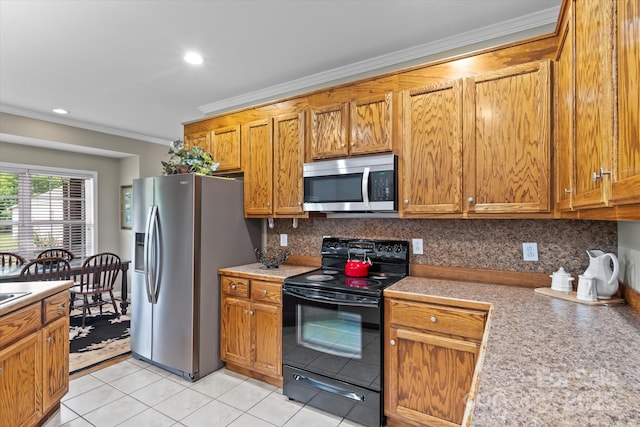 kitchen featuring crown molding, light countertops, brown cabinets, and stainless steel appliances