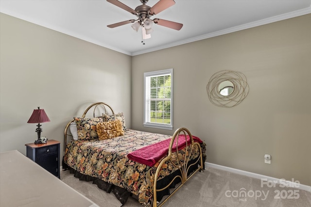 bedroom featuring baseboards, ornamental molding, ceiling fan, and carpet