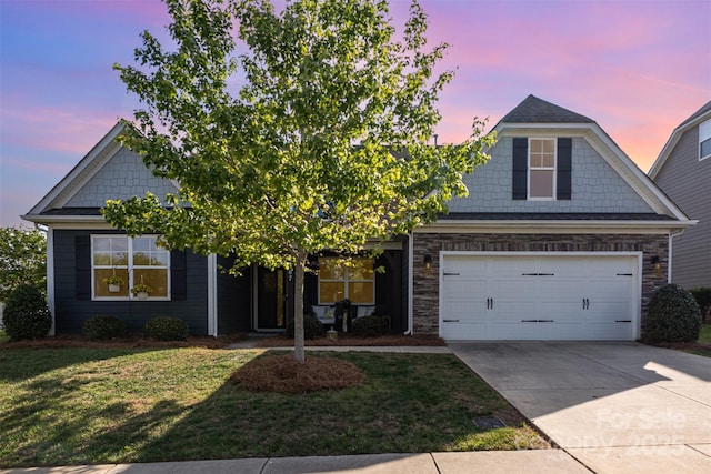 view of front of property with stone siding, driveway, and a front yard