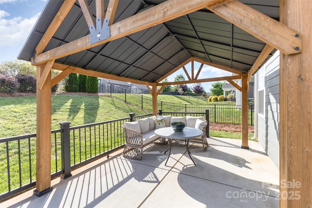 view of patio / terrace with a gazebo, outdoor lounge area, and a fenced backyard