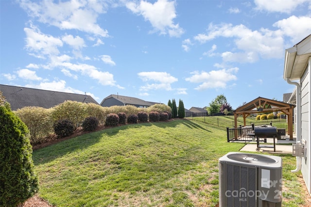 view of yard with a gazebo, central air condition unit, a patio, and fence