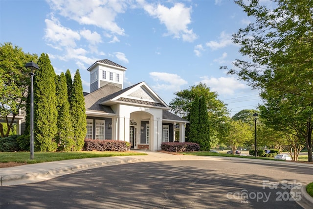 view of front of home with a standing seam roof and metal roof