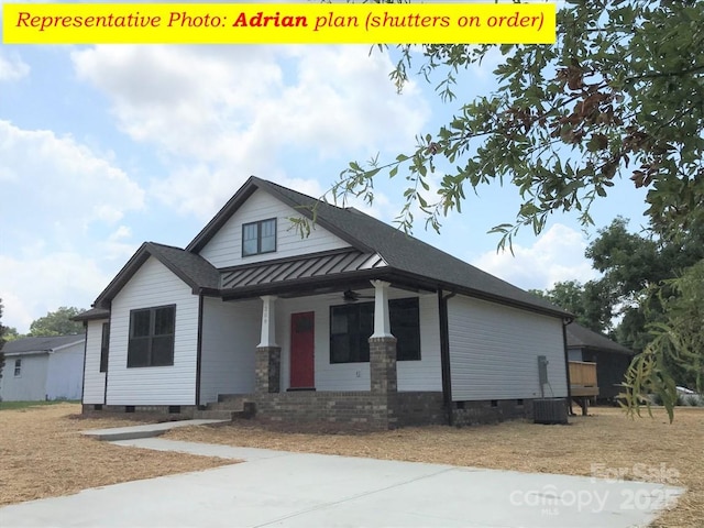 view of front of home with a porch, crawl space, a standing seam roof, and metal roof