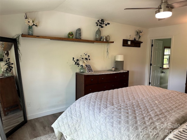 bedroom featuring baseboards, ceiling fan, and wood finished floors