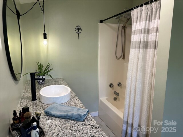 full bathroom with vanity, tile patterned flooring, and shower / tub combo with curtain