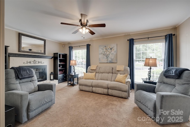 8525 Castlekeep Rd Unit 26, Charlotte, NC 28226 - living area featuring light colored carpet, a ceiling fan, ornamental molding, and a glass covered fireplace