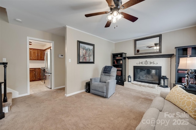 8525 Castlekeep Rd Unit 26, Charlotte, NC 28226 - living room with a brick fireplace, light colored carpet, ceiling fan, crown molding, and baseboards