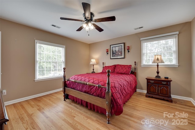 8525 Castlekeep Rd Unit 26, Charlotte, NC 28226 - bedroom with wood finished floors, baseboards, and a ceiling fan