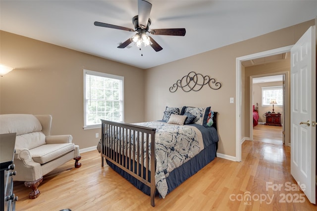 8525 Castlekeep Rd Unit 26, Charlotte, NC 28226 - bedroom featuring attic access, light wood finished floors, and baseboards