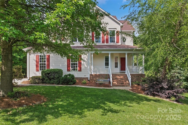 view of front facade with a front lawn and covered porch