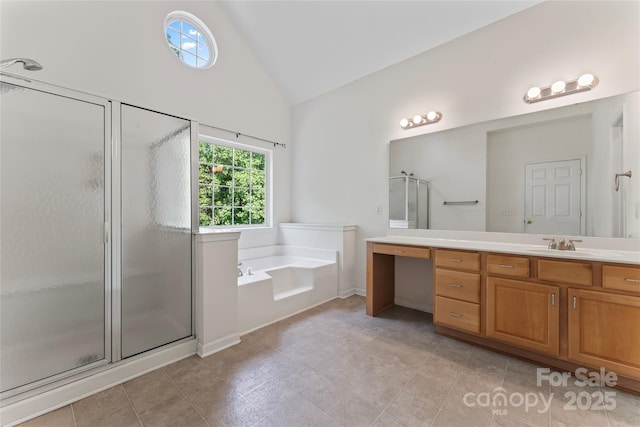 bathroom featuring vanity, a bath, high vaulted ceiling, and a shower stall